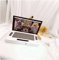 PawTec Foldable Laptop-Style Cat Scratcher with an orange kitten playing beside its attached mouse toy
