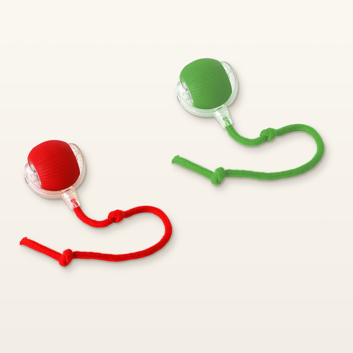 Green and red PawTec Smart Rolling Pet Balls with knotted rope tails